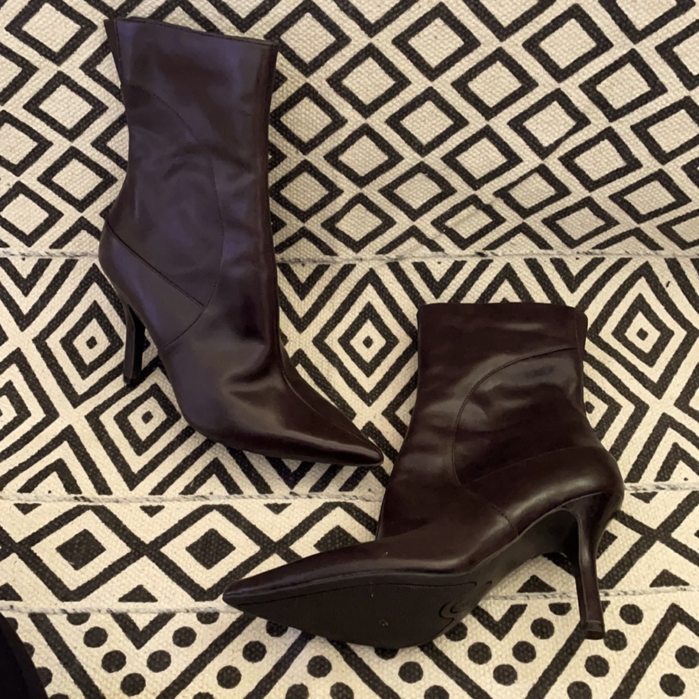 Dark brown heeled boots.